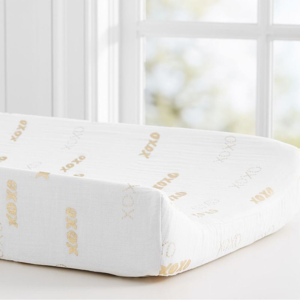 Pottery Barn Kids Organic XO Changing Pad Cover in gold and white